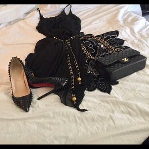 Christian Louboutin studded patent leather pumps